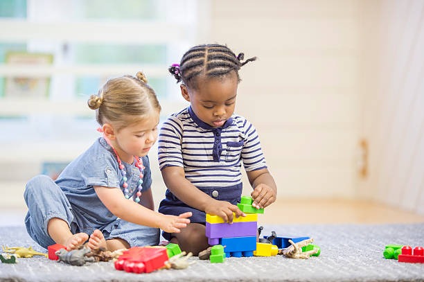 two girls playing blocks