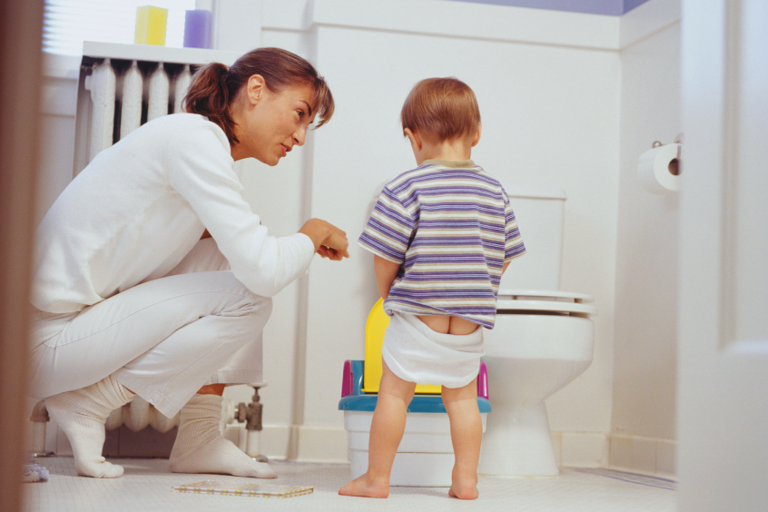 Mother potty training her son