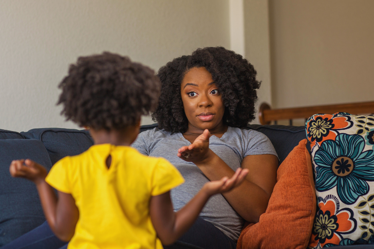 African-American mother having a conversation with her daughter