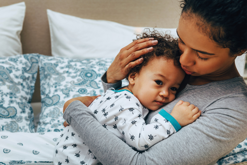 Mother comforting toddler